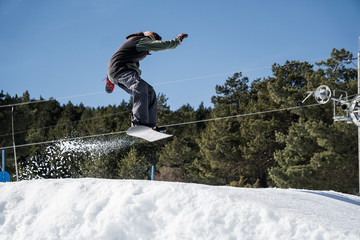 Snowboarder snowy jump