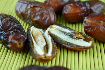 sweet algerian arabic split dates fruits open on a wooden ground