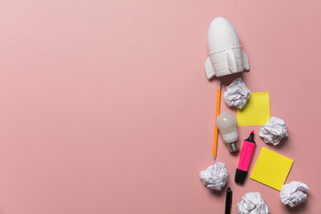 Business startup concept. Rocket taking off with crumpled paper trail