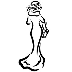 Fototapeta premium Slender lady in a long coat with a bag in her hands
