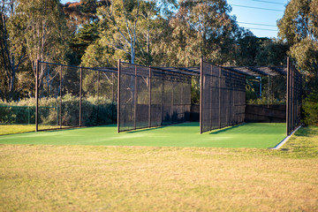 A cricket practice net on green grass in Melbourne, Victoria, Australia