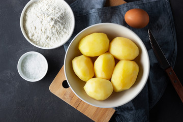 Naklejka na ściany i meble Ingredients for cooking Italian cuisine gnocchi - boiled potatoes, flour, egg and salt.
