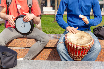 two street musicians play bongo