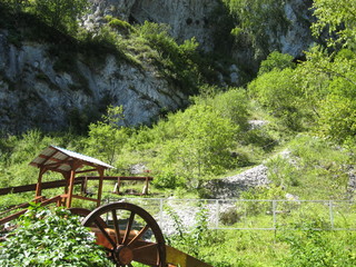wooden gazebo and cart at the foot of the mountains