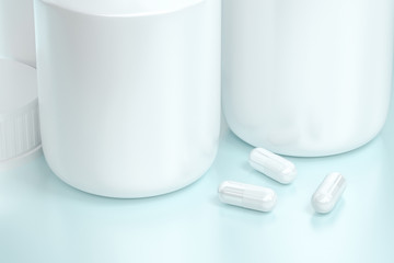 3d rendering, white medicine bottle with capsules