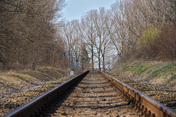Fototapeta premium Railroad tracks. Construction of railway tracks. Railway infrastructure. The tracks run across the horizon. Sunny weather.