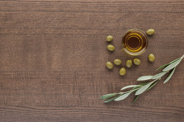 olive oil on wooden table top view with copy space for your text. flat lay. 