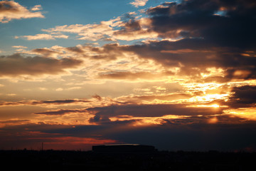 Sky with clouds and sun. Sunset