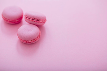 pink macaroons on pink background