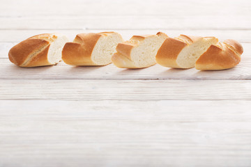 baguette on white wooden background