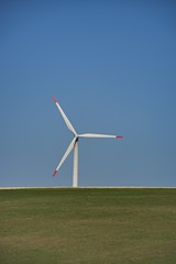 Fototapeta premium Wind turbines. Renewable energy with wind turbines. Windmills for electric power production.