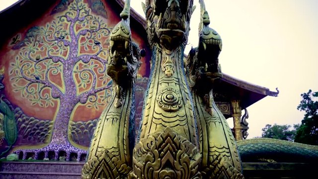 Thailand - Ubon Ratchathani: 10 April 2019: Thai people take family to visit Sirindhorn Wararam Phupha Temple (Wat Phu Phrao) in the evening near a very beautiful temple.