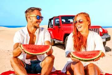 Summer car on beach and two lovers 