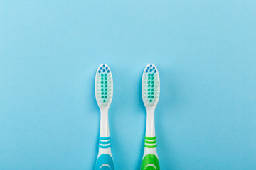 Two new toothbrush on a blue background. concept