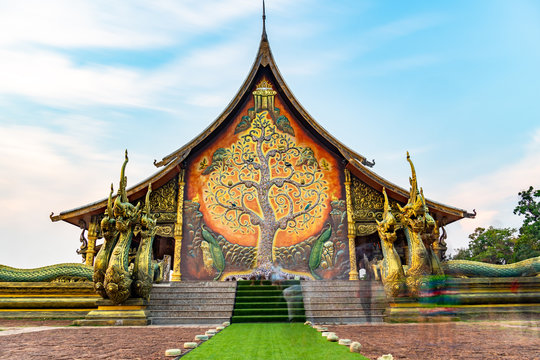 Thailand - Ubon Ratchathani: 10 April 2019: Thai people take family to visit Sirindhorn Wararam Phupha Temple (Wat Phu Phrao) in the evening near a very beautiful temple.
