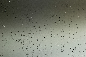 Water / rain drops on grey surface. Abstract background