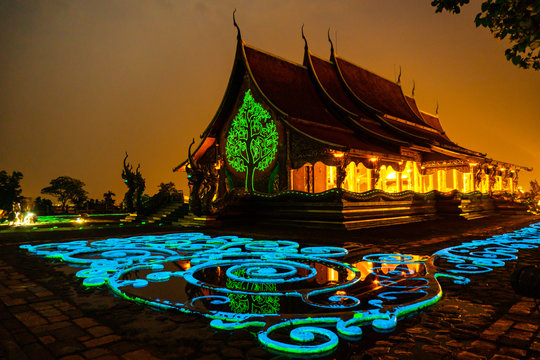 Thailand - Ubon Ratchathani: 10 April 2019: Thai people take family to visit Sirindhorn Wararam Phupha Temple (Wat Phu Phrao) in the evening near a very beautiful temple.