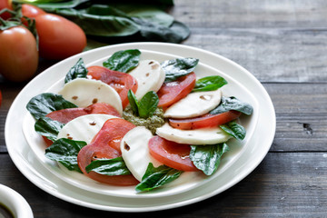 Caprese salad with pesto and balsamic vinegar