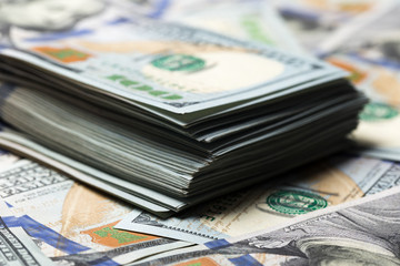 American dollars. A stack of hundred dollar bills. Close up