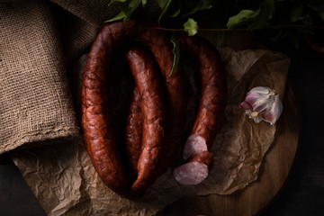 A homemade thin smoked sausage. Traditional natural sausage