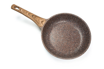 Photo of a ceramic frying pan with a wooden handle isolated on a white background. Studio shot