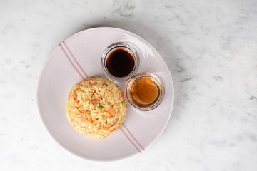 Fried Rice with vegetables and sauce on a plate \ in a bowl
