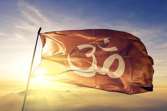 Hindu flag waving on the top sunrise mist fog