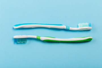 Two new toothbrush on a blue background. concept