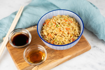 Fried Rice with vegetables and sauce on a plate \ in a bowl