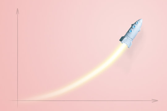 Launching toy cartoon rocket with flame trail on pink background as symbol of growing