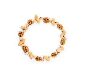 Frame made of different tasty nuts on white background