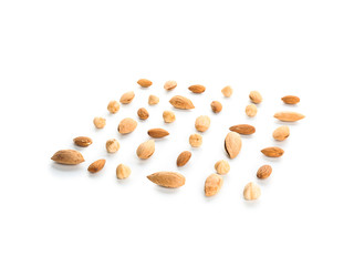 Different tasty nuts on white background