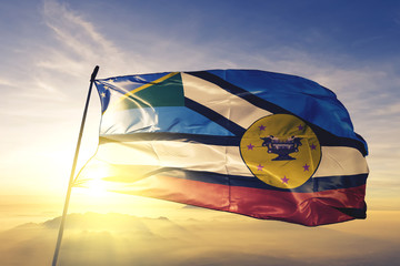 Makira-Ulawa province of Solomon Islands flag waving on the top sunrise mist fog