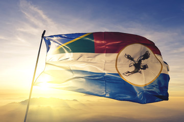Malaiita province of Solomon Islands flag waving on the top sunrise mist fog