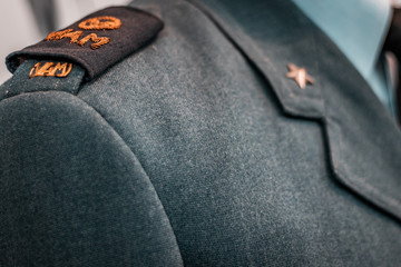 Shoulder close up shot. Details of historical Italian military uniforms. Grades and patches on high...