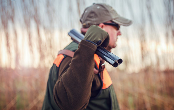 Hunter with a rifle in hunting