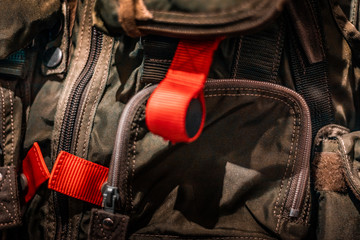 Red emergency label. Details of military and aviation jump suits. Italian air force fabrics. 