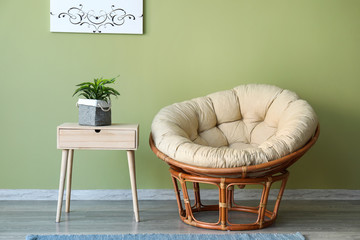 Interior of room with armchair and table