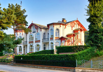 Wooden stairs on Old Baltic House in the park on the beach promenade Zinnowitz on the island of Usedom.