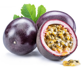Passion fruits and its cross section with pulpy juice filled with seeds. White background.