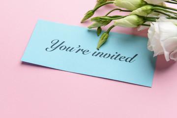Invitation with flowers on color background