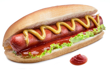 Hot dog - grilled sausage in a bun with sauces isolated on white background.