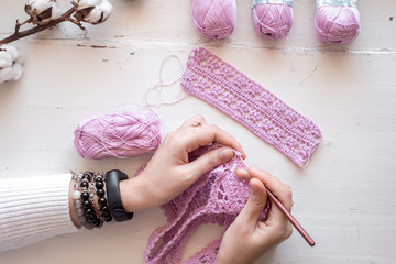 Petals purple crochet flower and wood crochet needles.