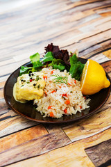 Andalusian fish, saffron rice with vegetables