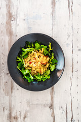 Salad made from radiatori cooked pasta, goat cheese and oil vinaigrette