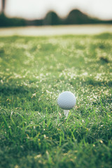 Golf ball on tee ready to be shot