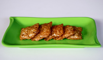 Fried tempeh on white background. Indonesian traditional food.