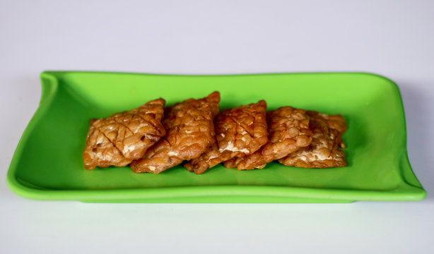 Fried tempeh on white background. Indonesian traditional food.