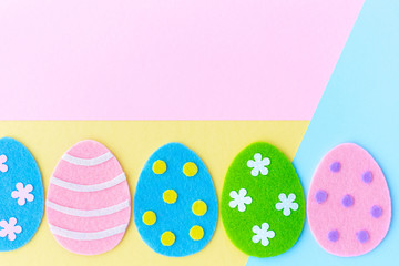 Beautiful vivid colorful Easter holiday background with copyspace on pink and yellow pastel background. Horizontal color flatlay photography.