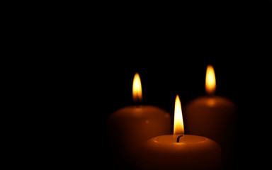 Burning candles as symbol of eternal memory.